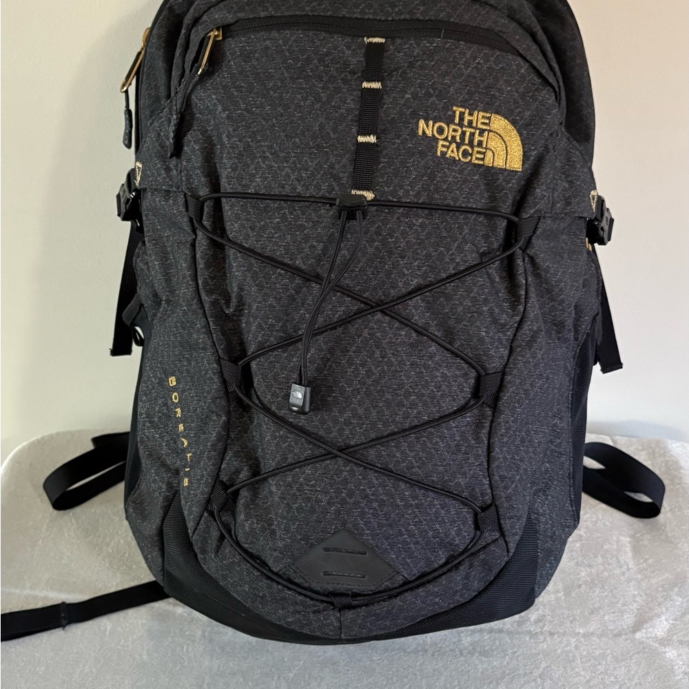 The North Face Black and Gold Backpack